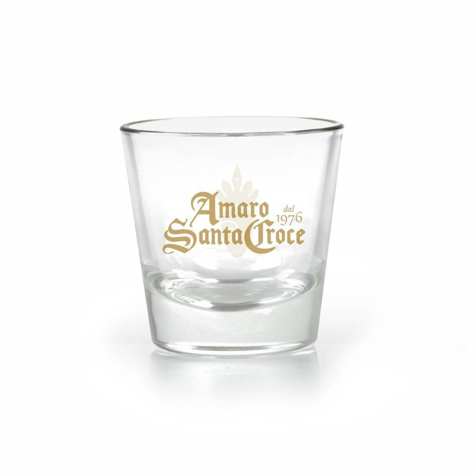 Bicchiere in vetro da 135 ml Amaro Santa Croce con logo dorato, ideale per servire amari e liquori artigianali tipici del Sannio e della Campania.

